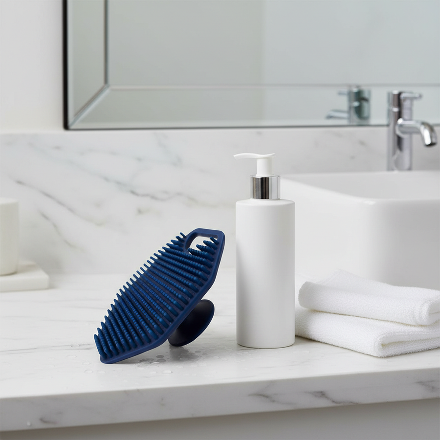Silicone face scrubber beside cleanser in a simple facial cleansing routine.
