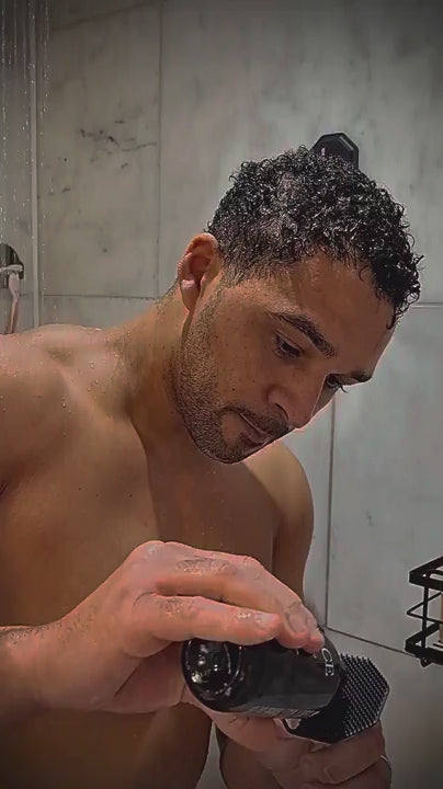 Lifestyle shower video of a man cleansing his face with the ScrubMeFace Breathtaking Blue silicone face scrubber.