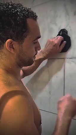 Lifestyle shower video of a man exfoliating his body with the ScrubMeBody Breathtaking Blue silicone body scrubber.