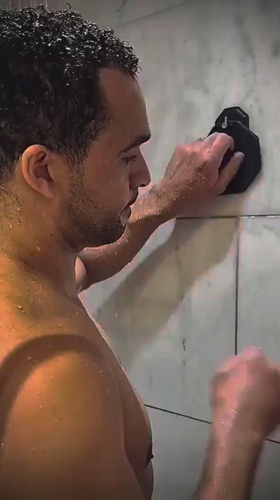 Lifestyle shower video of a man exfoliating his body with the ScrubMeBody Breathtaking Blue silicone body scrubber.