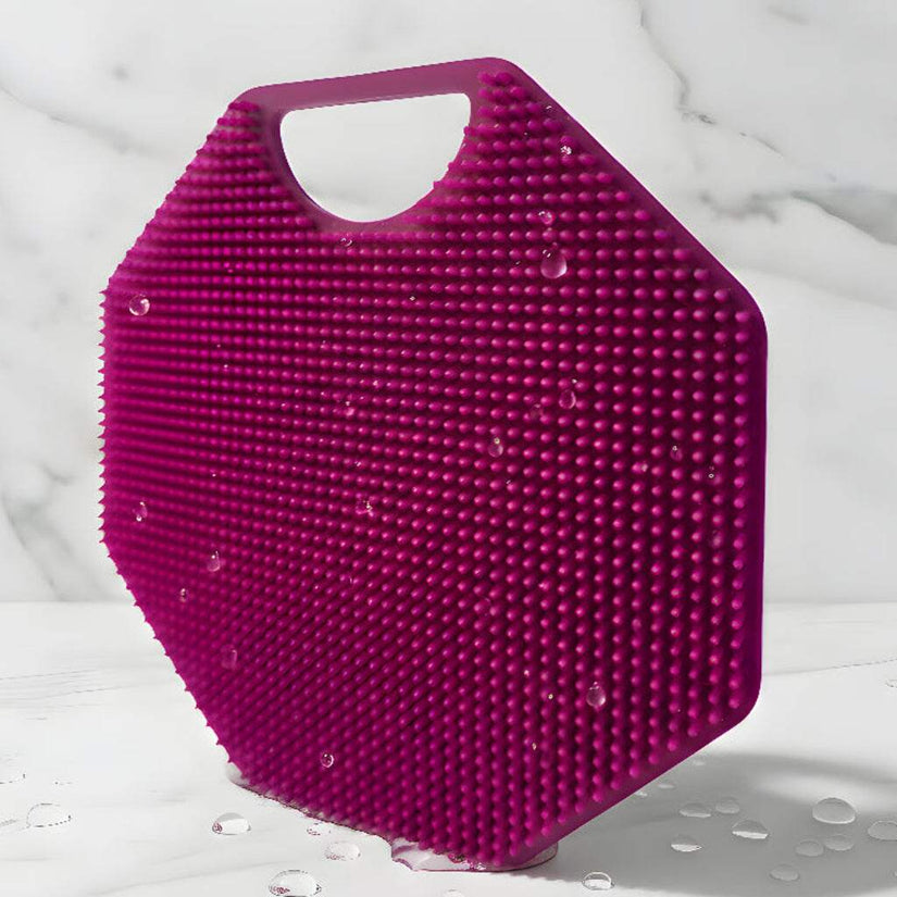 Hero Image ScrubMeBody Passionate Purple silicone body scrubber bristle side standing upright on marble with water droplets.