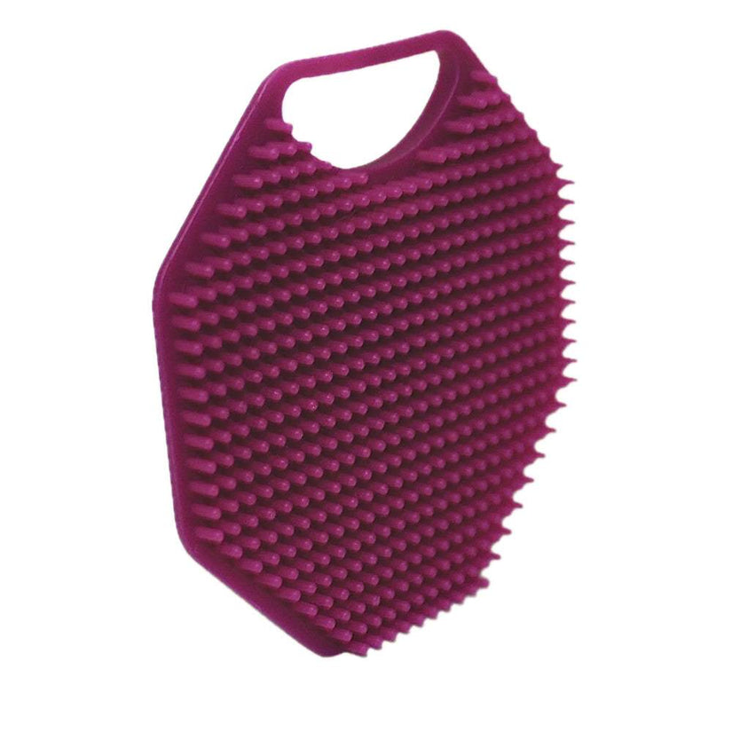 Angled back view of the ScrubMeFace Passionate Purple silicone face scrubber showing dense exfoliating bristles.