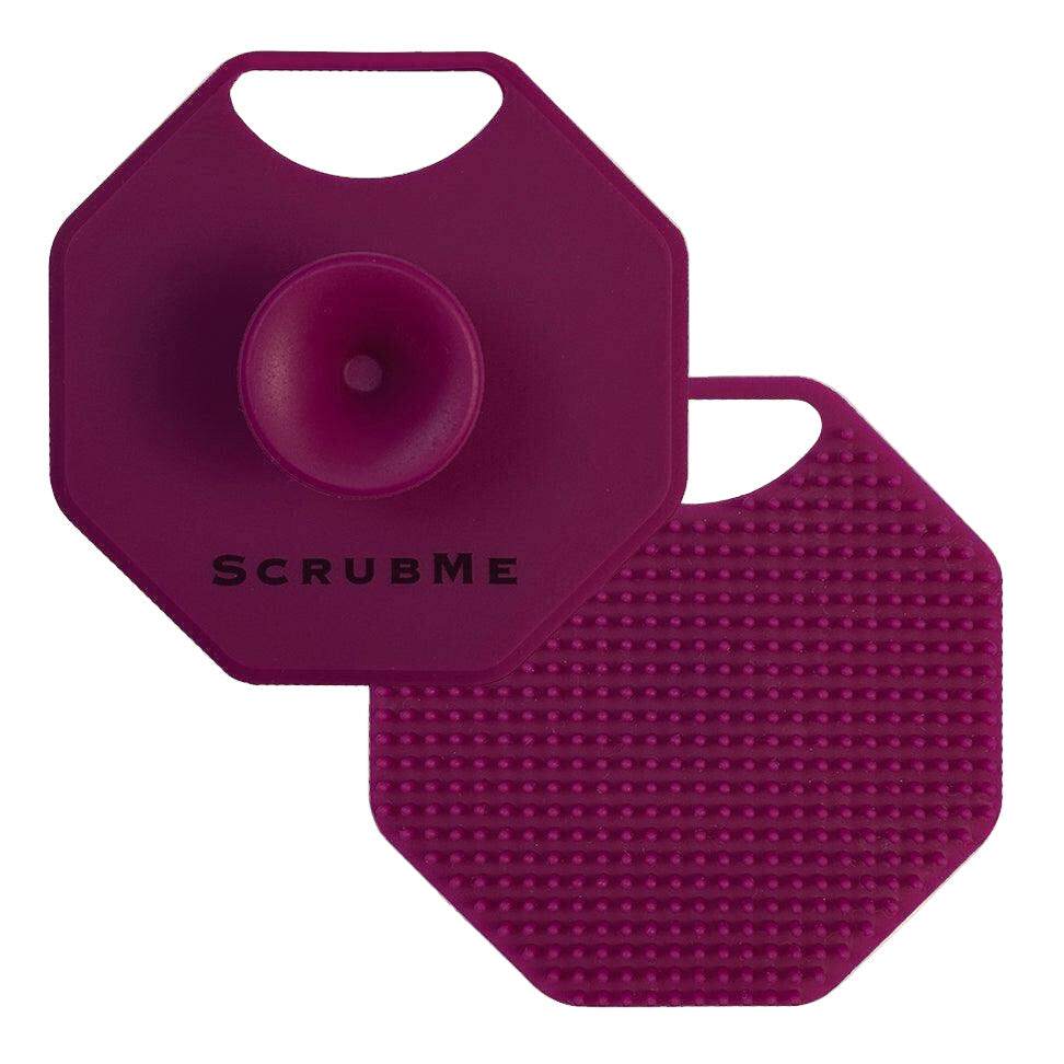 ScrubMeFace Passionate Purple silicone face scrubber showing suction handle front and exfoliating bristle back on a white background.