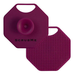 ScrubMeFace Passionate Purple silicone face scrubber showing suction handle front and exfoliating bristle back on a white background.