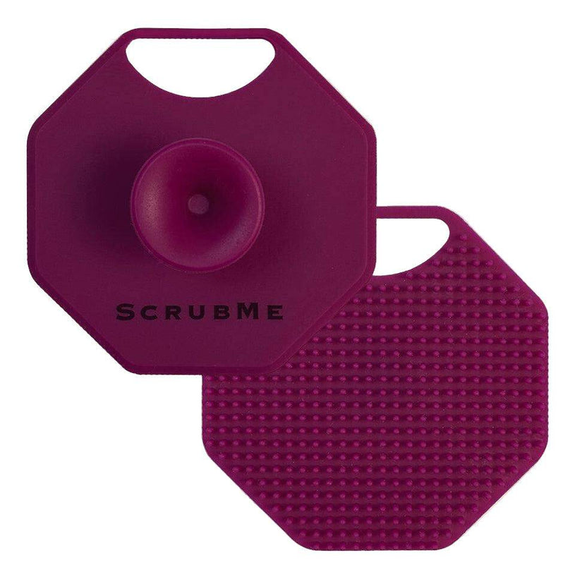 ScrubMeFace Passionate Purple silicone face scrubber showing suction handle front and exfoliating bristle back on a white background.