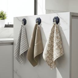 Three Breathtaking Blue HookMe hooks with tea towels hung by loops on kitchen panel